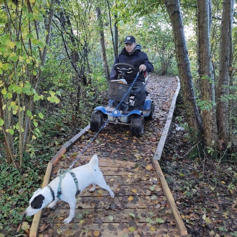 Rachel & trevor the dog on a mobility scooter showing accessibility